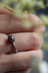 My Acorn Stacking Ring features a central textured dome in an acorn cup worn in oxidised silver