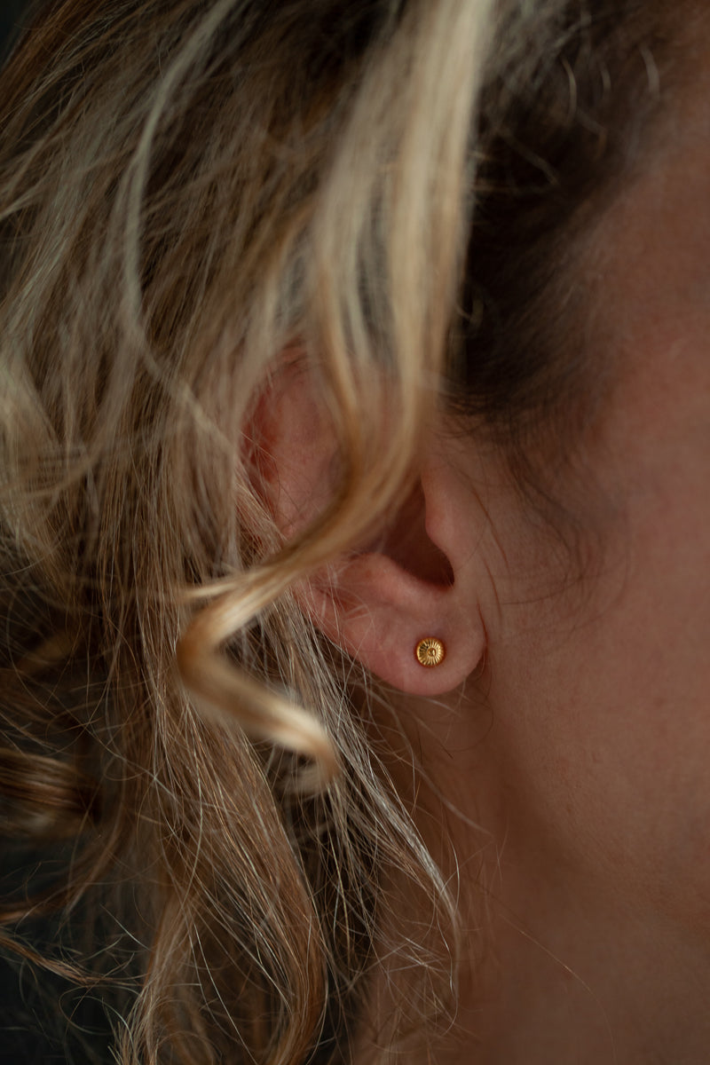 These small but intricately formed stud earrings are unusual and eye-catching. Their shape and texture was inspired by fungi.