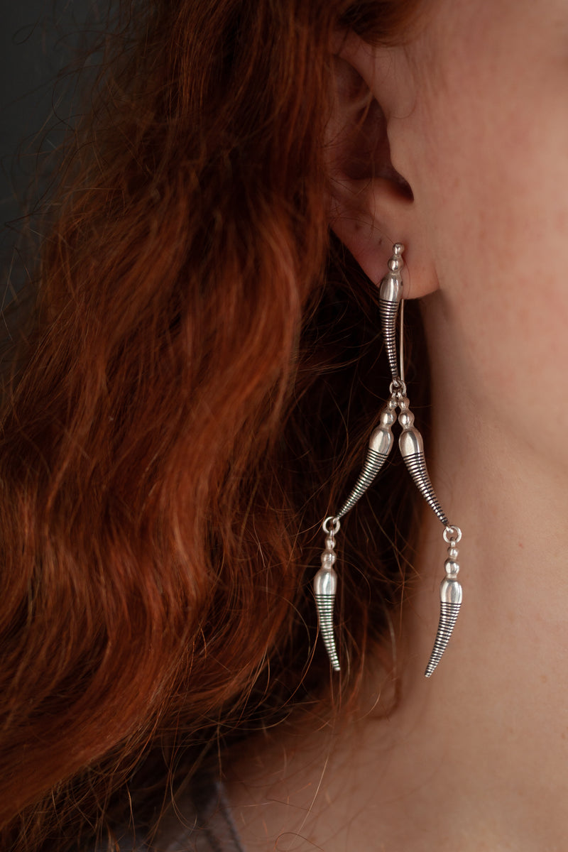 A daring new design in oxidised silver and silver inspired by the details and shapes of a dragonfly. 
