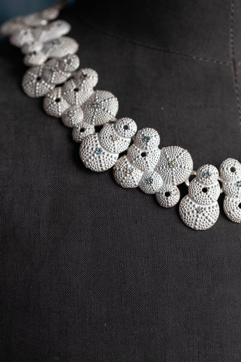 Close up of my limited editions Urchin Necklace, decorated with 44 gemstones, that sits neatly over the collar bone 