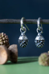 My Acorn Drop Earrings in oxidised silver feature a textured drop charm sitting in a small cup like an acorn 