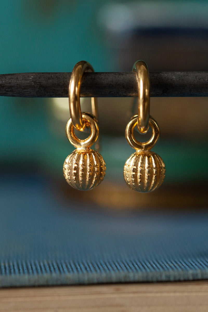 My Round Pod Drop Earrings feature round striped and notched ball charms on hooped sleepers