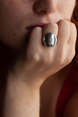A statement signet ring with a smooth, tactile mirror finish that can be hand-engraved.