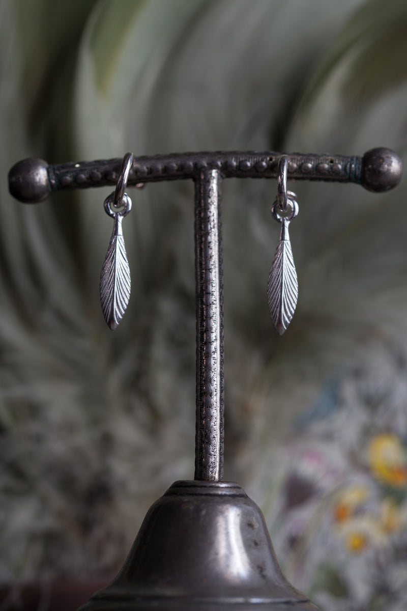 My Feather Drop Earrings in silver are hung with a feather charm 