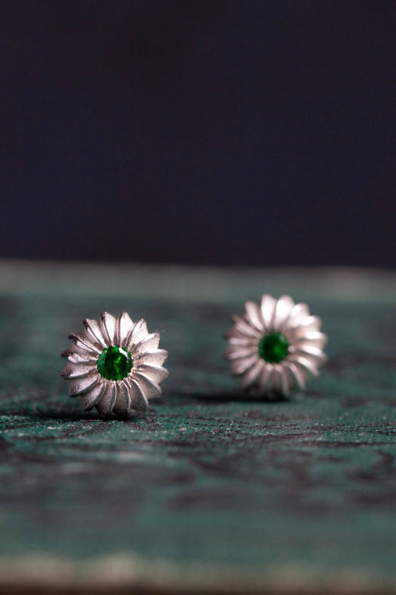 My January Green Garnet Birthstone Satsuma Studs are subtly striped and set with gemstones