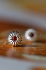 My January Orange Spessartite Garnet Birthstone Satsuma Studs are subtly striped and set with gemstones