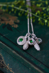 An unusual dainty pendant featuring a cluster of five intricate silver pollen charms on a fine silver trace chain 3 set Green Garnets January's birthstone
