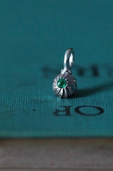 A delicate swirling gemstone charm – choose an Emerald for your May  birthday. 