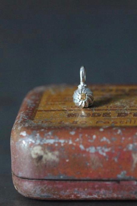 A delicate swirling gemstone charm – choose a yellow Topaz for your November birthday. 