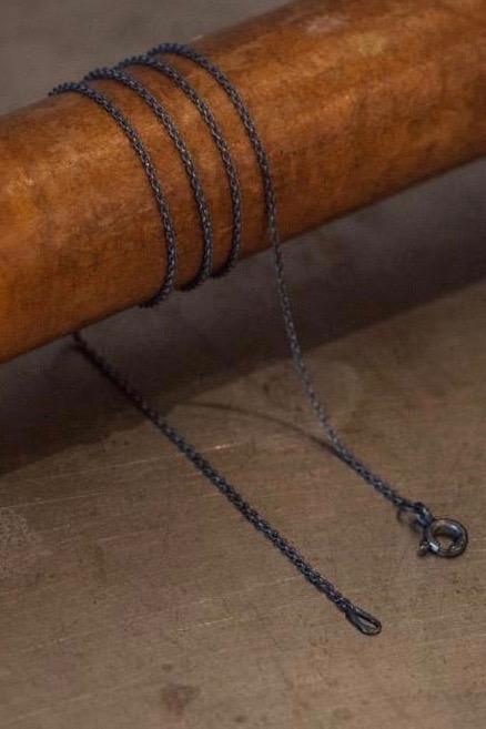 A fine trace chain in oxidised silver especially for charms to hang on