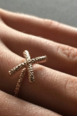 My Kiss Cross Ring is formed from a cross or kiss mounted on a simple band worn in gld plated silver