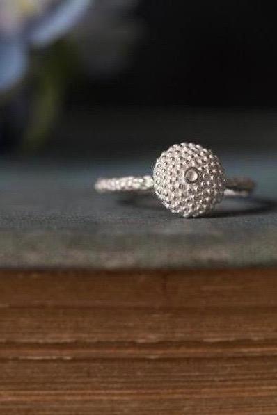 My Bobbled Pollen Stacking Ring has a circular centrepiece surrounded by my signature bobble texture 