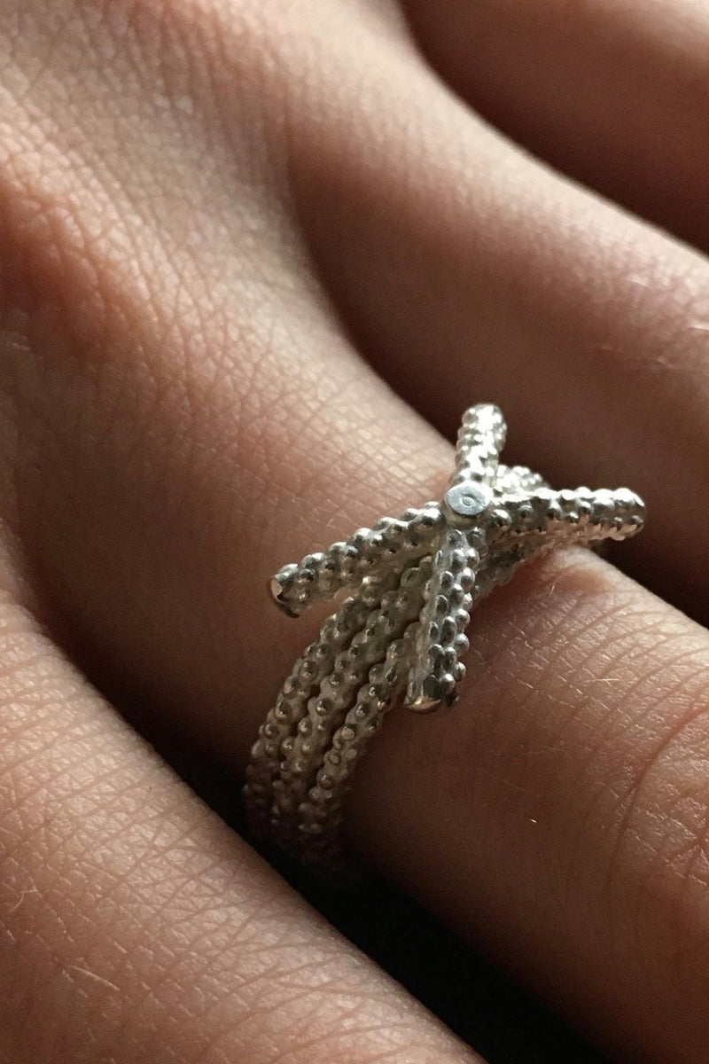 My Triple Kiss Cross Ring worn in silver
