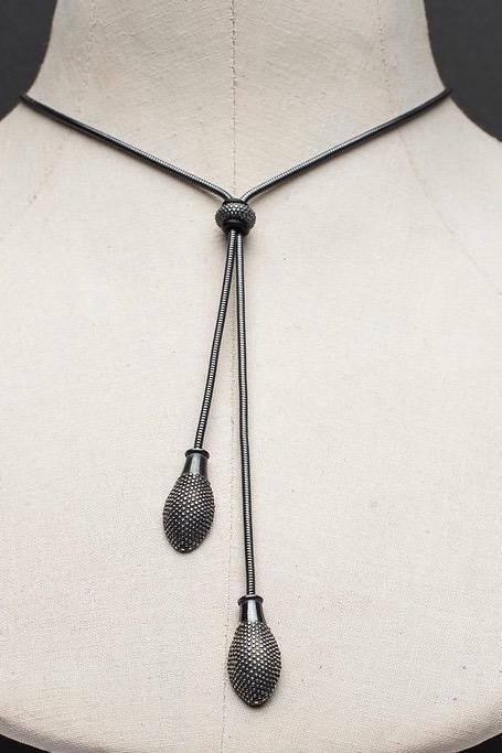 This statement tassel necklace in oxidised silver, move the bead to customise how the necklace falls