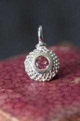 An elegant charm with a bobbled pattern – choose a pink Tourmaline for October your birthday
